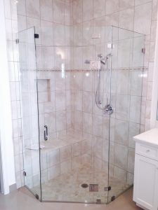Custom corner shower door installed in a Boca Raton bathroom