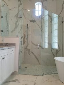 Custom corner shower doors installed in a Greenacres bathroom