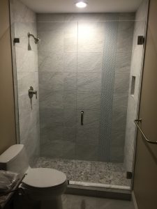 Custom shower door installed in a West Palm Beach bathroom